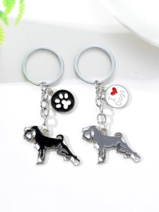Detail of Schnauzer dog keychains with I Love Dogs charms in black and grey enamel finish