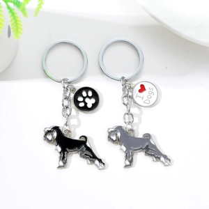 Detail of silver Schnauzer dog keychains with I Love Dogs enamel charms and paw print patterns