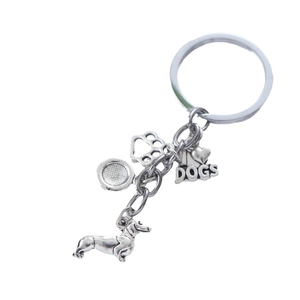 Porte-clés teckel en métal argenté avec patte de chien et pendentif cœur pour cadeau