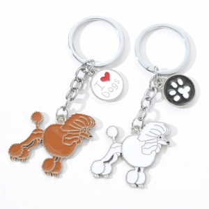 Detail of Poodle dog enamel keychains with I Heart Dogs tag and metal ring in brown and white