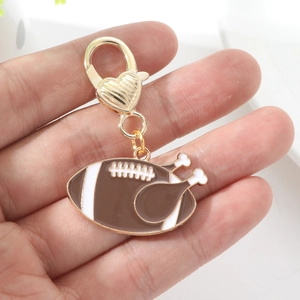 Porte-clés créatif dinde de football américain avec fermoir coeur doré pour cadeaux
