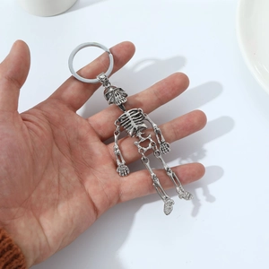 Articulated metal skeleton keychain with vintage silver finish and movable joints