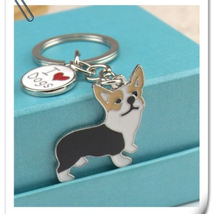 Corgi shaped enamel keychain with I Love Dogs charm on light blue gift box accessory
