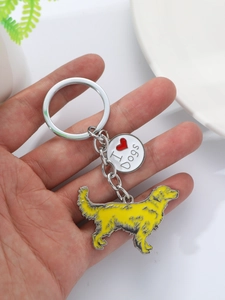 Detail of dachshund metal keychain with yellow enamel puppy charm and I Love Dogs pendant