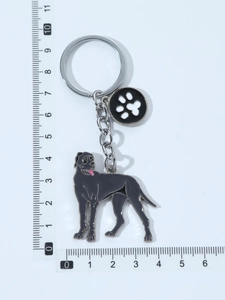 Detail view of Great Dane enamel keychain with paw print charm on a white background