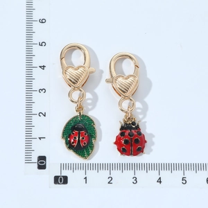 Cute ladybug and leaf enamel keychain set with heart-embossed gold lobster clasp