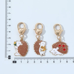 Three cute hedgehog pendants with gold metal lobster clasp and colorful enamel finish