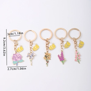 5-piece flower and honeybee keychain set in zinc alloy with gold finish and enamel detail