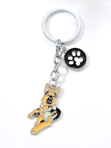 Detail of German Shepherd enamel keychain with a silver ring and small paw print charm