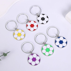 Detail of soccer ball keychains in six vibrant colors on a minimalist background