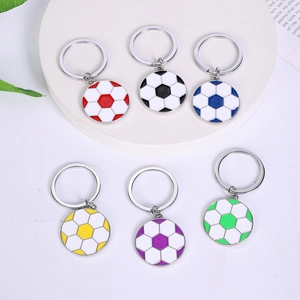 Detailed view of soccer keychains in six vibrant colors on a white pedestal display