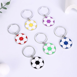 Flat lay of colorful zinc alloy football keychains in six vibrant enamel finishes