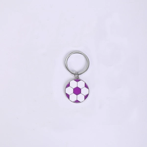 Detailed view of the purple and white enamel football pendant with a silver metal keychain