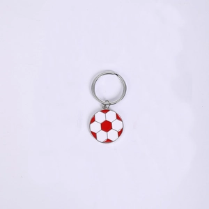 Detailed close-up of a red and white football soccer ball enamel keychain in zinc alloy