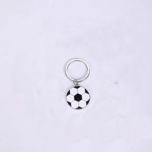 Detailed close-up of a zinc alloy football keychain with a black and white enamel pendant