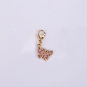 Detailed view of butterfly pendant with pink crystals and gold-plated zinc alloy lobster clasp