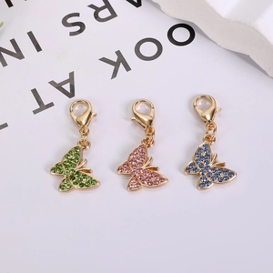 Colorful butterfly charms in green, pink, and blue with rhinestones and lobster clasps