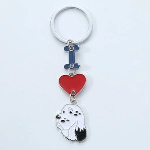 Dog tag keychain with blue bone, red heart, and cartoon puppy enamel charms