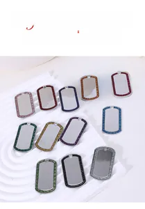 Macro view of zinc alloy glitter edge dog tags in various colors for pet collars