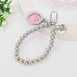Detail of silver beaded keychain featuring a crystal photo frame and heart pendant
