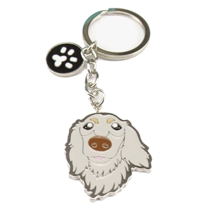Custom metal dog keychain featuring long-haired dachshund head and paw print charm