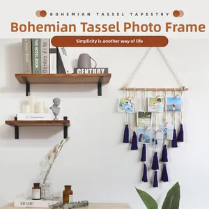 Close-up of bohemian tassel photo hanger with purple fringe and natural wood clips