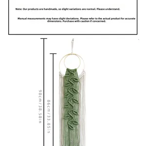 Detail showing handwoven green cotton leaf tapestry with white fringe and wood rings