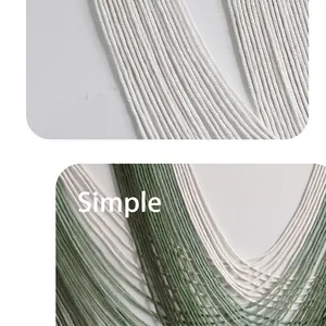 Detailed close-up showing the gradient green cotton texture of handmade macrame wall hanging