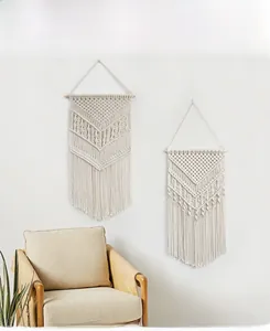 Detail of Nordic bohemian hand-woven macrame wall hanging with cotton rope tassels