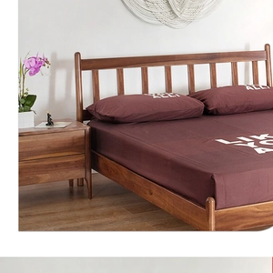 Detail of soft brown bedding set featuring modern white LIKE YOU ALL text print