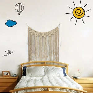 Detail of bohemian handmade woven wall tapestry with tassels for home bedroom decoration