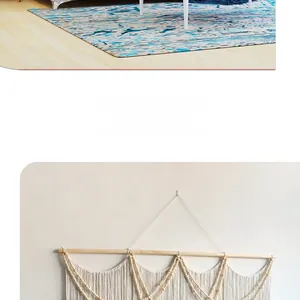 Detail of bohemian handmade woven tapestry with wooden beads and blue patterned rug decor