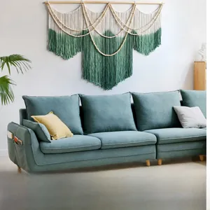 Detail of gradient boho tapestry with handmade weaving and decorative wooden beads