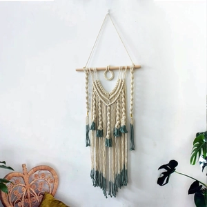 Handmade bohemian woven tapestry with green tassels and wooden rod for wall decor
