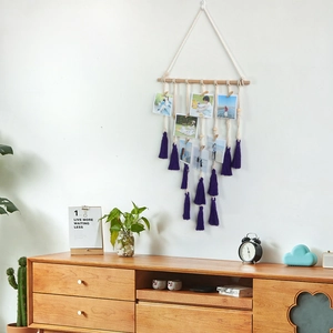 Handmade macrame photo hanging display with wood pole and purple tassel decoration