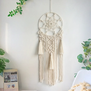 Bohemian handmade woven macrame wall hanging with circular dreamcatcher and long tassels