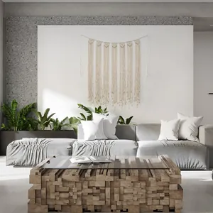 Close-up of handmade macramé wall hanging with woven cotton rope and long tassels