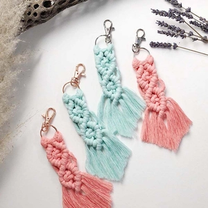 Detail of handmade macrame keychains featuring cotton rope weaving and tassel fringe