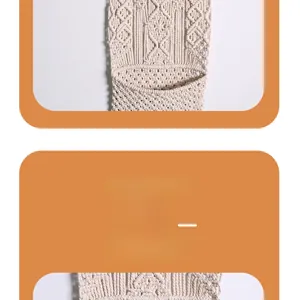 Detail view of handmade macramé wall storage pocket with white woven cotton textures