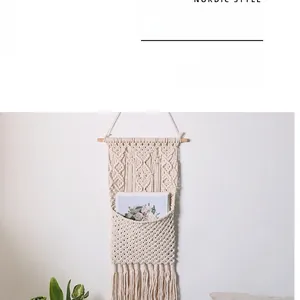 Macro view of bohemian macrame wall hanging storage pocket with woven cotton diamond pattern