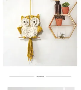 Detail of handmade macrame owl wall hanging with woven cotton rope and wood rod