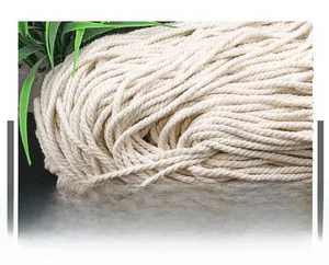Detailed macro view of natural braided cotton rope showing soft woven fiber texture