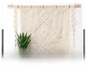 Detail showing the intricate hand-woven geometric macrame patterns and natural cotton rope