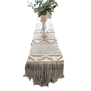 Bohemian hand-woven cotton table runner with diamond patterns and long tassels