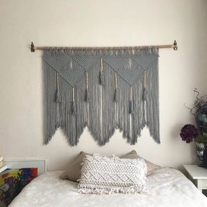 Handmade bohemian grey cotton wall tapestry with geometric weaving and wooden beads