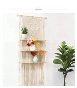 Detail of bohemian handmade woven cotton rope with three-tier solid wood storage shelves