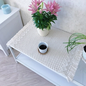 Handmade macrame table runner with fringe and geometric patterns for home decor