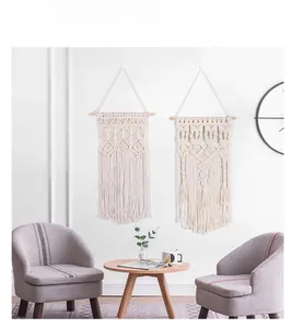 Detail of bohemian woven macrame wall hanging with intricate knots and long tassels