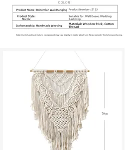 Close-up of handmade bohemian woven wall hanging with cotton fringes and wood rod