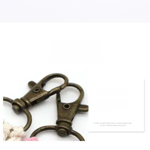 Detail of vintage bronze swivel lobster clasp with durable electroplated metal finish